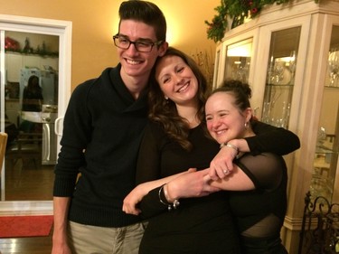 Amanda gets big hugs from sister Courtney and brother-in-law Adam.