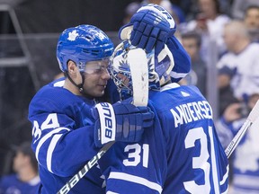 Toronto Maple Leafs' Auston Matthews (left) celebrates with goaltender Frederik Andersen after defeating the Montreal Canadiens in NHL hockey action in Toronto, on April 7, 2018.