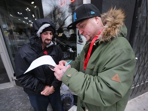 Volunteers from the Homeless Coalition of Windsor-Essex County and the City of Windsor hit the streets of Windsor on Tuesday, April 17, 2018 to conduct a survey on the number of homeless people in the city. Kevin Poulin, 48, left, takes the survey from volunteer Chris Thibert.