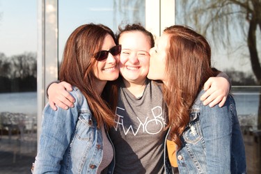 Amanda gets big kisses from Courtney and mom at Chateau Vaudreuil in Quebec.