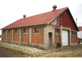 Two barns faced with clay brick on Sunningdale Road just west of Adelaide Street in London are considered historic and must be preserved according to the city. (Mike Hensen/The London Free Press)