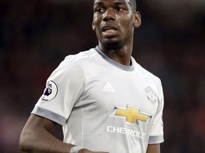 Manchester United's Paul Pogba looks on, during the English Premier League soccer match between Bournemouth and Manchester United, at the Vitality Stadium, in Bournemouth, England, Wednesday April 18, 2018.