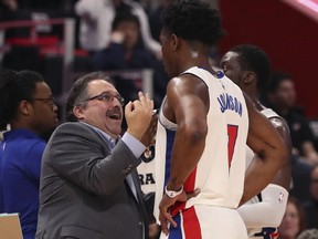 Detroit Pistons head coach Stan Van Gundy, left, talks to Detroit Pistons forward Stanley Johnson during the second half of an NBA basketball game against the Dallas Mavericks, Friday, April 6, 2018, in Detroit.