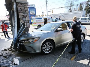 Windsor police investigate a single-vehicle crash after an elderly driver suffered minor injuries when a pillar was struck at the Motor City Credit Union at Tecumseh Road East and Rose Ville Garden Drive around 4 p.m. Friday, April 20, 2018.