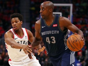 Anthony Tolliver of the Detroit Pistons drives around Kyle Lowry of the Toronto Raptors during the first half at Little Caesars Arena on April 9, 2018 in Detroit. (Gregory Shamus/Getty Images)