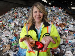 Cat Griffin, communications specialist with the Essex-Windsor Solid Waste Authority, displays examples of plastic lids that are not recyclable but have made it to the city's recycling centre in Windsor on Wednesday, April 18, 2018.