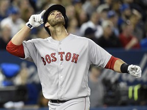 Boston Red Sox's J.D. Martinez reacts after hitting a home run during AL action against the Toronto Blue Jays in Toronto on Thursday, April 26, 2018. (THE CANADIAN PRESS/Nathan Denette)