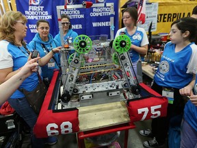 Members of the Build-a-Dream Amazon Warriors from the Windsor area strategize on Friday, April 27, 2018 at the FIRST Robotics World Championships at Cobo Center in Detroit, MI.