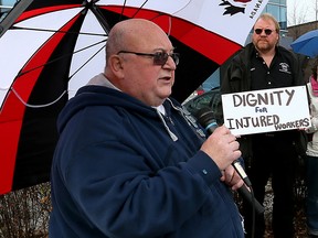 Rolly Marentette (left) shown speaking during a rally in support of injured workers  in 2015, will be honoured during a National Day of Mourning service and march in Windsor Saturday, April 28. (NICK BRANCACCIO/Windsor Star)