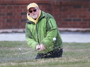 Charlie Armstrong hits a bunker shot at the Roseland Golf Club on Tuesday, April 10, 2018.