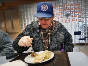 The Salvation Army started a new community meal initiative on Wednesday, April 4, 2018, to help feed needy people in the community. Daniel Tupper digs into his hot meal at the Church St. location.