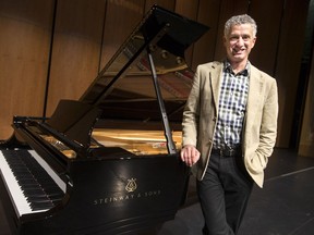 Windsor Symphony Orchestra director Robert Franz, shown here during the unveiling of a special Steinway piano at the Capitol Theatre, Oct. 17, 2017, will be conducting the orchestra during the unveiling of an original composition celebrating Point Pelee National Park's 100th anniversary.