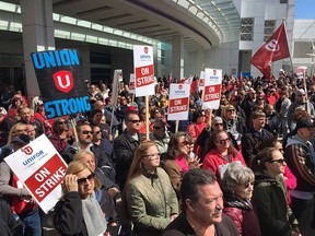 Striking employees of Caesars Windsor and their supporters rally outside the casino complex on April 22, 2018.