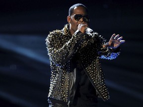 FILE - In this June 30, 2013, file photo, R. Kelly performs onstage at the BET Awards at the Nokia Theatre in Los Angeles. The Time's Up campaign is taking aim at R. Kelly over numerous allegations he has sexually abused women. The organization devoted to helping women in the aftermath of sexual abuse issued a statement on Monday, April 30, 2018, urging further investigation into Kelly's behavior.