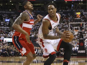 Washington Wizards Bradley Beal G (3) fights to guard Toronto Raptors DeMar DeRozan SG (10) in the fourth quarter in Toronto on April 25, 2018.