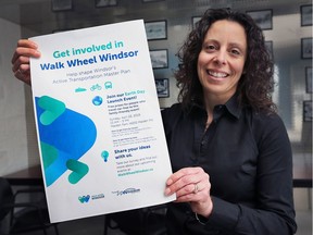 Josette Eugeni, manager of transportation planning for the City of Windsor displays the Walk Wheel Windsor poster on Thursday, April 5, 2018. It is an 18-month project aim to develop an active transportation master plan for the city.