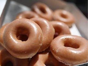 In this photo illustration, Krispy Kreme Donuts are seen on May 09, 2016 in Miami, Florida.