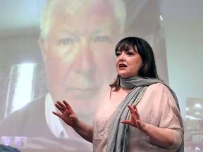 Natalie Mehra, Exec. Director of Ontario Health Coalition, discussed the OHC's platform with area residents at a meeting held at Windsor Public Library Monday. Dr. John Lister, shown on screen behind, also joined the meeting.