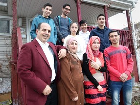 Front left to right: Muftakher Al Hayik, Lina Alnatour, Shahed Alhaik and Kamal Alamour. Back left to right: Omar, Mohamad, Waed, Osama and Abdul Alhaik. The family members are photographed at their home in Windsor.