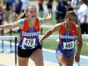 Sandwich's Karlie Moore, left, and teammate Jasmine Scott-Kilgo, right, helped the Sabres capture the OFSAA track and field girls' overall team championship on Saturday.