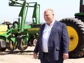 Doug Ford walks to the podium at the Trepanier Farm on Lakeshore Road 235 May 23, 2018.  Ford made an announcement and took five questions from the media.