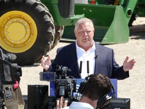 Doug Ford addresses the media and about 10 local farmers at the Trepanier Farm on Lakeshore Road 235 May 23, 2018.  Ford made an announcement and took five questions from the media.