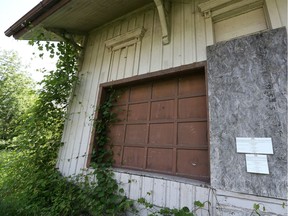 A public notice to sell the property is posted by Canadian National Railway on an exterior wall of the former Comber Railway Station on May 29, 2018.