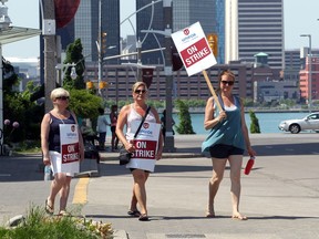 Striking Caesars Windsor employees walk the picket lines at the casino resort on May 29, 2018.