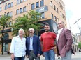 New life for vacant buildings. Dino Maggio, left, Stephen Savage, Anthony Maggio and Brian Schwab, shown May 31, 2018, have formed a partnership between Mid South Land Development and Cypher Systems to purchase and renovate the currently vacant properties that housed the former Beer Market and Chatham Street Grill.