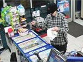 On Friday May 11, 2018 at approximately 2:20am, patrol officers were dispatched to a convenience store located in the 2600 block of Lauzon Road for a robbery that just occurred.   Investigation revealed that a male suspect entered the store with his identity concealed with a black mask and approached the employee.  He brandished a knife and demanded cash, which was then placed into a white and green plastic bag.  He left the store with a quantity of money.   The suspect was described as being male white, approximately 6'0, plaid shirt and black pants.