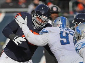 Akeem Spence (97), seen being blocked by Chicago's Kyle Long (75) last season,  was dealt by the Detroit Lions on Thursday to the Miami Dolphins for a late NFL Draft pick in 2019.