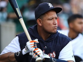 Miguel Cabrera of the Detroit Tigers, who is not playing due to injury, takes practice swings in the dugout while playing the Tampa Bay Rays at Comerica Park on May 1, 2018 in Detroit.