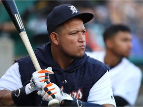 Miguel Cabrera of the Detroit Tigers, not playing due to injury, takes practice swings in the dugout while playing the Tampa Bay Rays at Comerica Park on May 1, 2018 in Detroit.