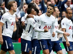 Tottenham Hotspur's Argentinian midfielder Erik Lamela (C) celebrates with teammates after scoring their fourth goal during the English Premier League football match between Tottenham Hotspur and Leicester City at Wembley Stadium in London, on May 13, 2018. Tottenham won the game 5-4.