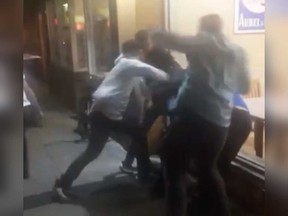 An image from a cellphone video of the assault incident in front of the Pizza Pizza at 294 Ouellette Ave. around 2:50 a.m. May 26, 2018.