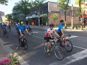 Participants in Bike to Work Day ride north on Ouellette Avenue in downtown Windsor on Monday May 5, 2018.