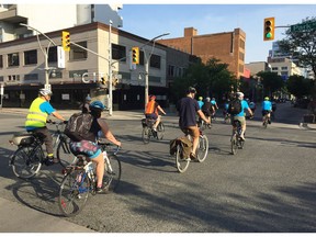 Participants in Bike to Work Day ride north on Ouellette Avenue in downtown Windsor. Volunteers with Bike Windsor Essex estimated 150 cyclists joined the event on Monday May 28, 2018.