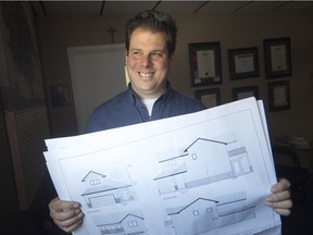 Jeff Sylvestre, owner of Lakepoint Homes, holds blueprints for the Brentwood Lottery Home, during a committee meeting at Brentwood Recovery Home, Tuesday, May 1, 2018.