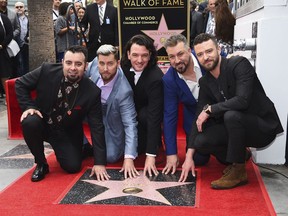 Chris Kirkpatrick, from left, Lance Bass, JC Chasez, Joey Fatone and Justin Timberlake attend a ceremony honoring NSYNC with a star on the Hollywood Walk of Fame on Monday, April 30, 2018, in Los Angeles.