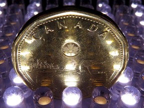 A loonie is pictured in North Vancouver, in April, 2014.