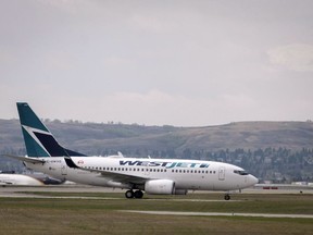 WestJet planes are seen at the Calgary Airport in Calgary, Alta., Thursday, May 10, 2018. WestJet Airlines says contract negotiations with its pilots resumed Monday in Calgary. Talks between the airline and pilots represented by the Air Line Pilots Association moved from Halifax where they took place last week.