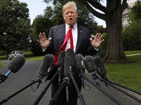 President Donald Trump's hair is ruffled by a breeze as he speaks to the media on the South Lawn of the White House in Washington, Wednesday, May 23, 2018, en route to a day trip to New York. Trump will hold a roundtable discussion on Long Island on illegal immigration and gang violence that the White House is calling a "national call to action for legislative policy changes."
