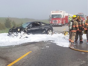 Firefighers attend the scene of a two vehicle accident on Highway 3 near Kingsville on May 23, 2018.