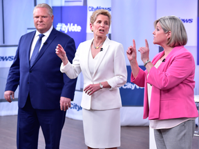Liberal Premier Kathleen Wynne, centre, Progressive Conservative Leader Doug Ford, and NDP Leader Andrea Horwath at the Ontario Leaders debate in Toronto on May 7, 2018.