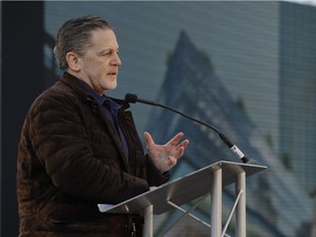 File - Quicken Loans founder Dan Gilbert, addresses attendees at the former site of the J.L. Hudson Co. department store on Dec. 14, 2017, in Detroit. Ground was broken for a new 800-foot-tall, $900 million two-building project that will include a 58-story residential tower and 12-floor building for retail and conference space. The tower will have an 800-foot-tall (244-meter) sky deck.