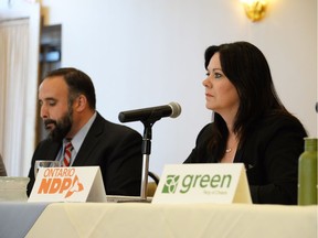 Windsor West Liberal candidate Rino Bortolin, left, and NDP incumbent Lisa Gretzky take part in an all-candidates' debate on mental health at The Other Place on Walker Road Thursday night.