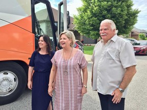 Ontario NDP leader Andrea Horwath (centre) visits a home in Windsor's Forest Glade neighbourhoods with New Democrat MPPs Lisa Gretzky (left) and Percy Hatfield (right) on May 30, 2018.