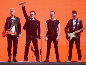 FILE - In this July 9, 2017, file photo, musicians, Adam Clayton, from left, Bono, Larry Mullen Jr. and The Edge, of the band U2, perform on stage at Twickenham Stadium in London. U2 will play a special one night show at New York's historic Apollo Theater. Howard Stern on Tuesday, May 15, 2018, announced the invitation only event for SiriusXM subscribers during his show on the satellite music service.