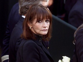 FILE - In this Oct. 3, 2000 file photo, actress Margot Kidder, who dated former Prime Minister Pierre Trudeau, arrives for his funeral at Notre-Dame Basilica in Montreal, Quebec. Kidder, who starred as Lois Lane in the "Superman" film franchise of the late 1970s and early 1980s, has died. Franzen-Davis Funeral Home in Livingston, Montana posted a notice on its website saying Kidder died Sunday, May 13, 2918, at her home there. She was 69.