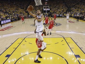 Golden State Warriors guard Stephen Curry shoots against the Houston Rockets during the first half of Game 6 of the NBA basketball Western Conference Finals in Oakland, Calif., Saturday, May 26, 2018.